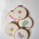 Illustration for article titled Cross-Stitched Microbes Let You Hang Your Favorite Germs on the Wall
